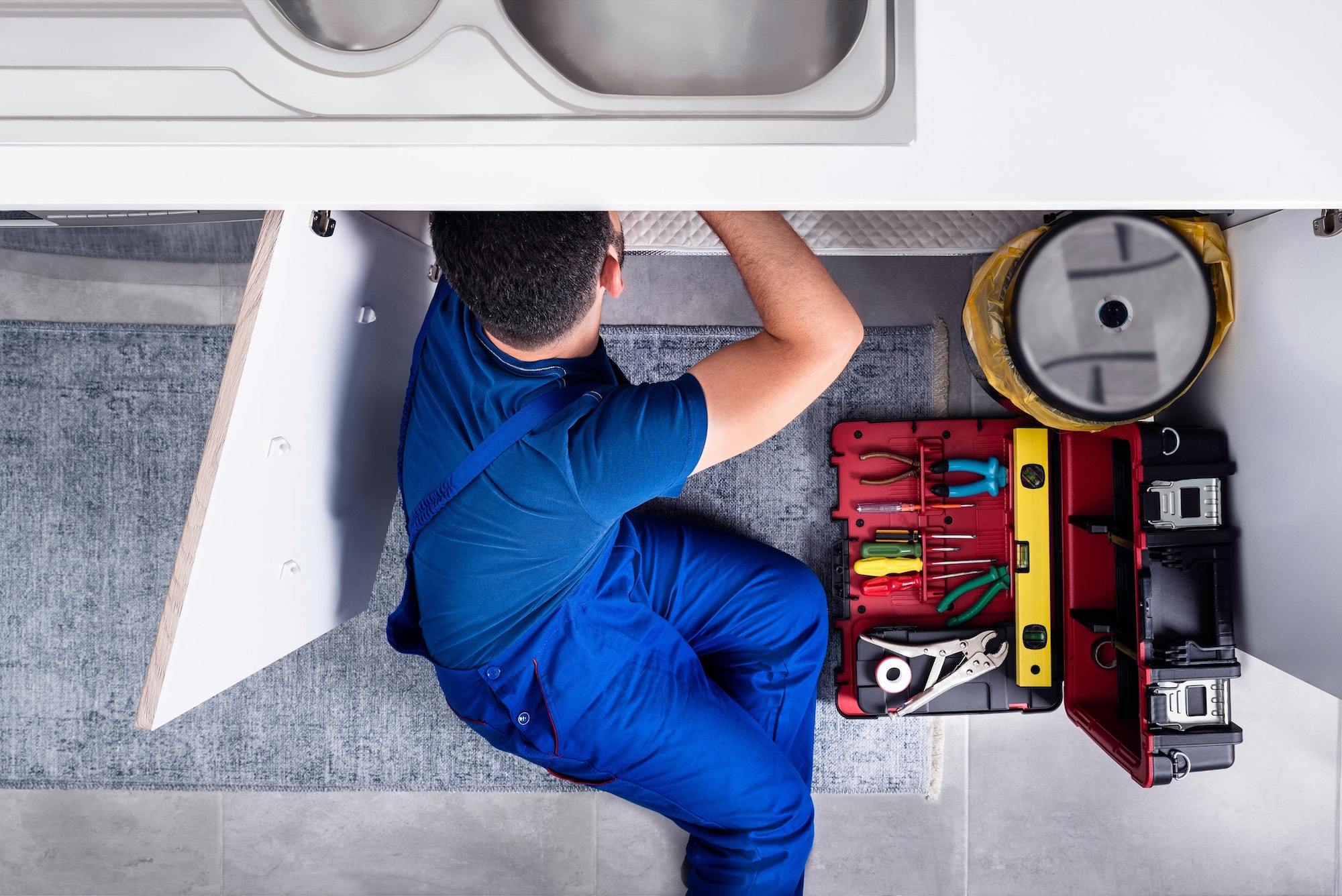 plumber drain cleaning kitchen sink