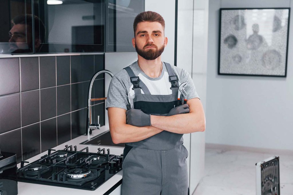 an image of professional plumber looking at the camera