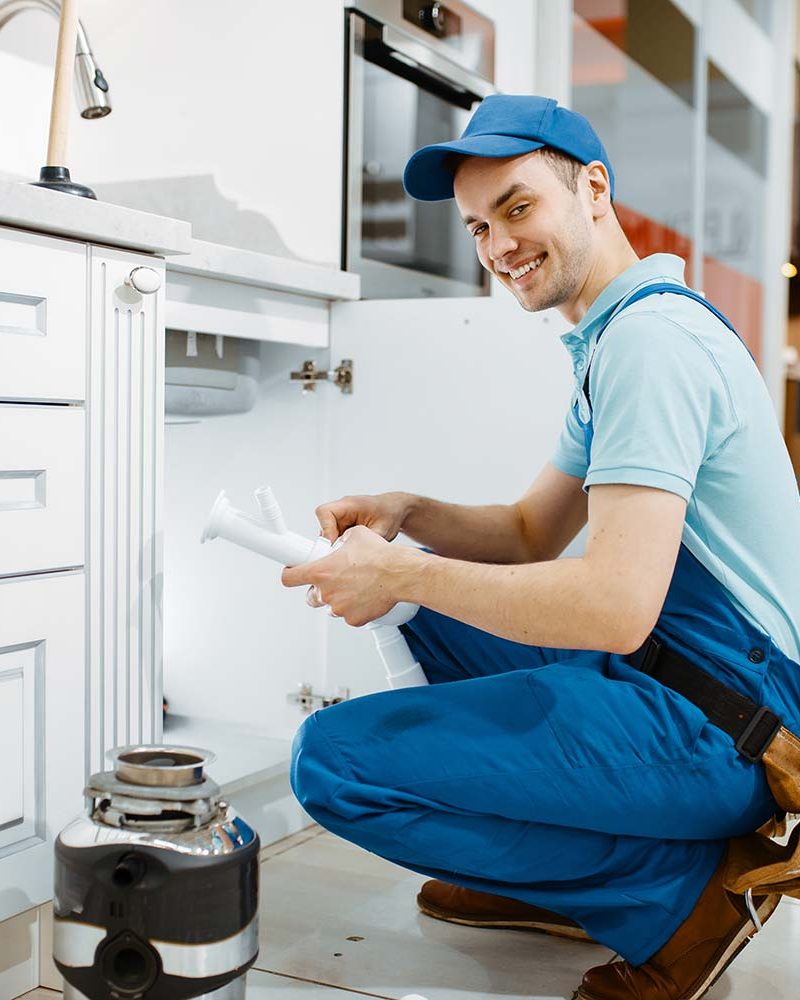 a professional plumber smiling